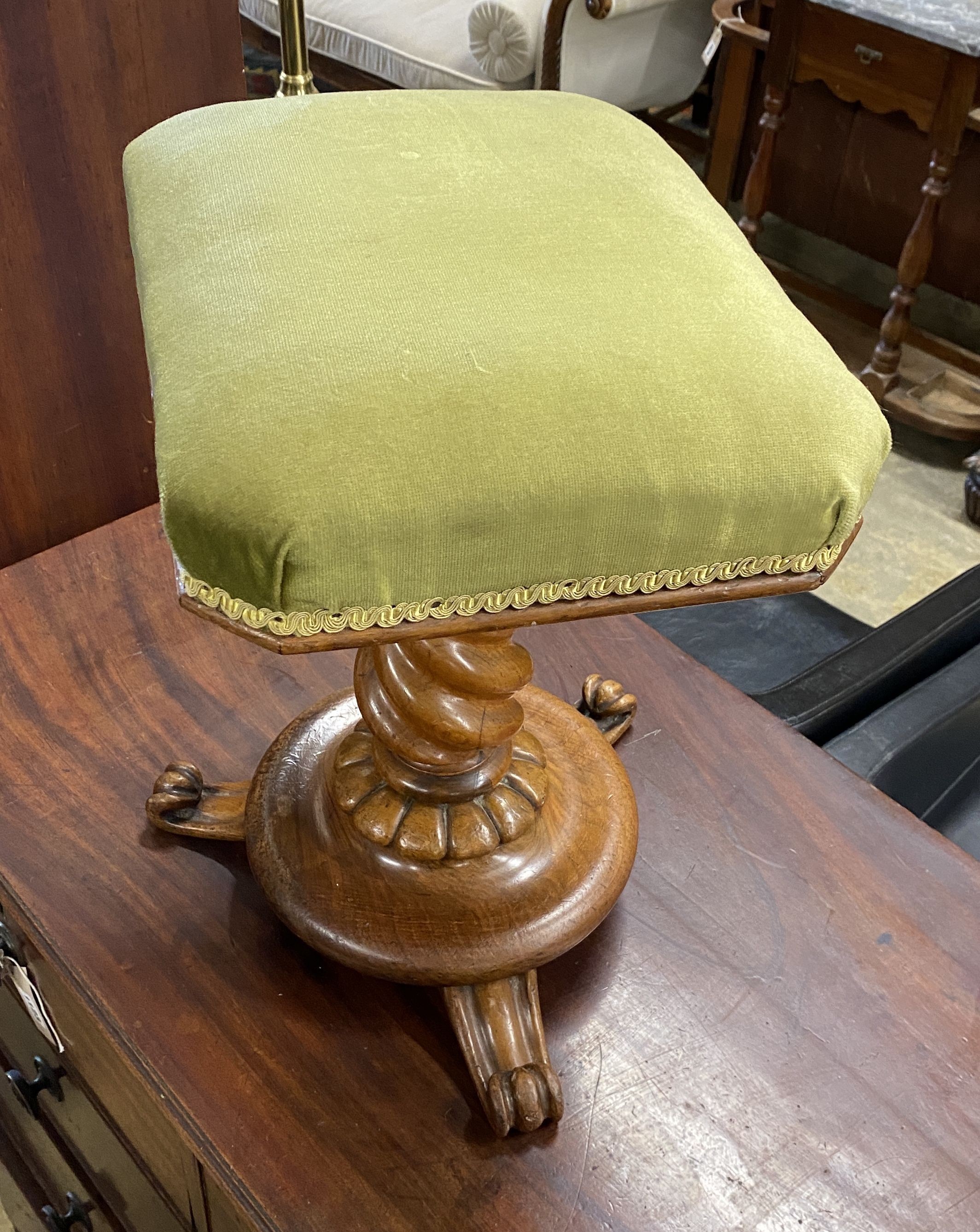 A Victorian turned walnut adjustable piano stool